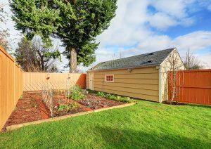 Small Vegetable Garden With Risen Beds In The Fenced Backyard And Shed From Keen's Buildings